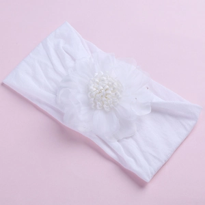 Soft nylon baby headband with a large white chiffon flower for toddler sports and hair styling