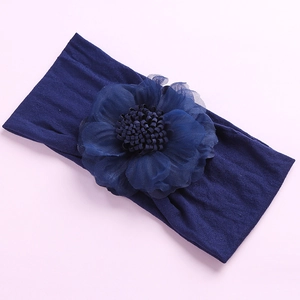 Detail of navy blue chiffon flower headband with elastic nylon band for babies
