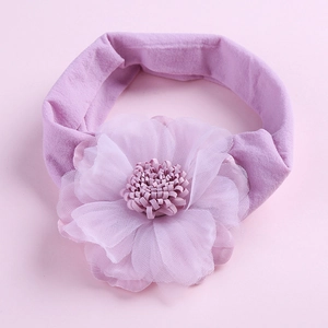 Detail view of high-elasticity nylon baby headband with a large layered chiffon floral flower
