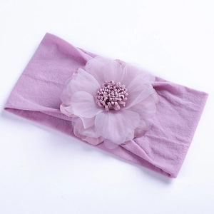 Close-up of soft purple elastic headband with a layered chiffon floral decoration