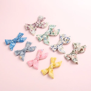 Set van zeven bloemen katoenen haarspeldjes in diverse kleuren voor baby's en peutermeisjes