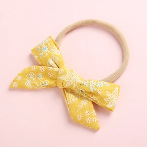 Cute floral yellow bow baby headband with soft nylon elastic band for infants