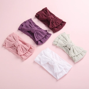 Five-pack baby cable knit headbands with large bows in assorted vibrant colors