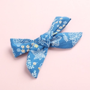 Sky blue floral fabric bow hair clip for girls with elegant handmade knot design