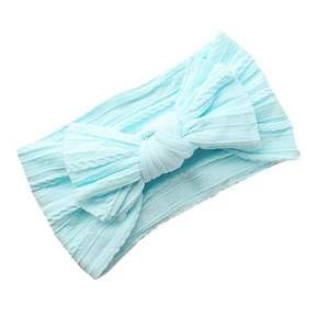 Light blue ribbed knit baby headband featuring a large bow on a clean white background