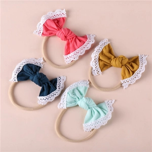 Set of four soft lace edge nylon baby headbands with bows in pastel colors