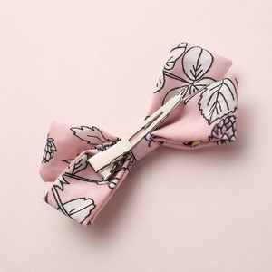 Pink cotton princess hair clip with floral print and silver metal alligator back