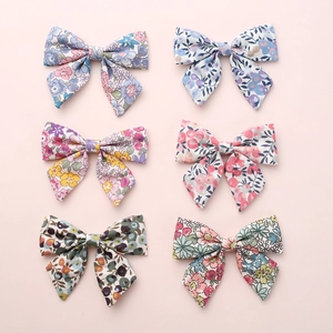 Set of 6 floral print linen bow hair clips for girls in various pastel colors
