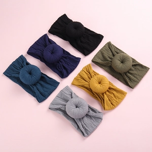 Set of six baby nylon headbands with cute 3D donut knots in various soft colors