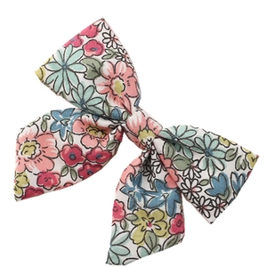 Floral print bow hair clip for toddlers and girls with elegant spring blossom pattern