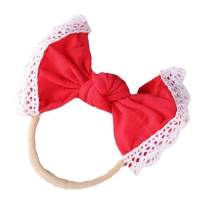 Soft red nylon baby headband with white lace trim and cute bunny ear bow design