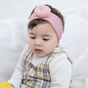 Diadema elástica rosa de nailon para bebé con un lindo lazo de donut en 3D para niñas