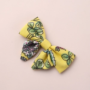 Fermaglio per capelli con fiocco floreale in cotone per bambine con motivi di foglie e fiori