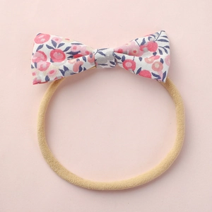 Bandeau bébé avec nœud floral rose et bleu sur ruban élastique en nylon souple