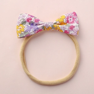 Bandeau bébé avec nœud à fleurs et bande en nylon souple à haute élasticité pour filles