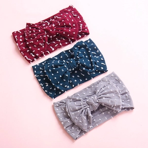 Three-piece set of baby nylon bow headbands in burgundy, navy, and light grey colors
