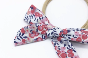Close-up of floral print cotton bow on a high-elastic nylon headband for infants
