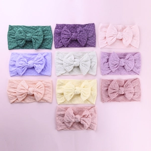 Set di 10 fasce per neonati colorate in nylon con grande fiocco a pois