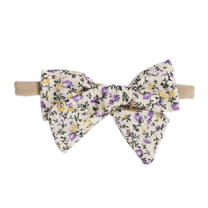 Soft floral cotton baby headband with bow and stretchy nylon strap for infants