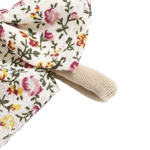 Macro detail of floral cotton bow headbands with soft elastic nylon band for infants