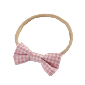 Soft nylon baby headband with a pink and white plaid checkered bow for infants