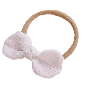 Bandeau bébé avec nœud en dentelle de coton blanche et élastique en nylon kaki souple
