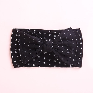 Bandeau bébé à pois mignons avec grand nœud en tissu doux et extensible