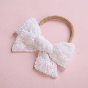 Bandeau bébé avec nœud en dentelle de coton brodé blanc et bande élastique douce