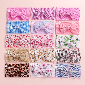 Collection of 15 styles of baby bow headbands featuring various cute floral and animal prints