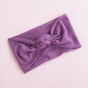 Soft purple nylon baby headband with cute knotted design and wide edge for infants