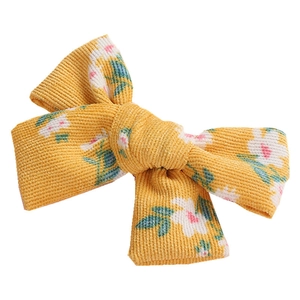 Floral print corduroy bow hair clip for girls with yellow fabric and BB pin detail