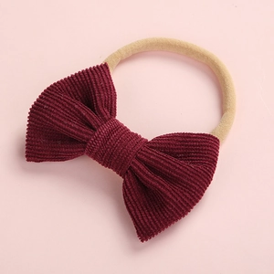 Bandeau bébé doux avec nœud en velours côtelé bordeaux et élastique beige souple