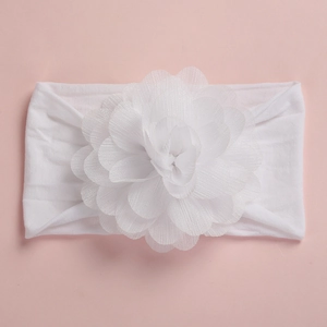 Detailed close-up of a white chiffon flower headband with soft elastic nylon for infants