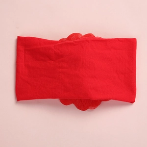 Detail of red elastic nylon headband with layered mesh chiffon flower for baby girls