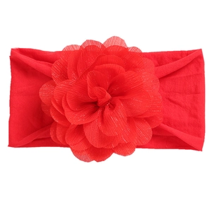 Vibrant red nylon headband with large layered mesh flower and subtle glitter accents