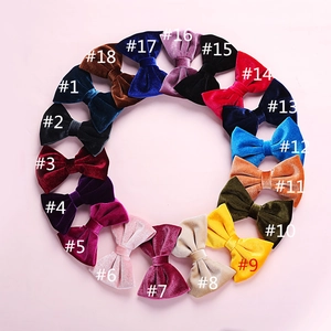 Flat lay of 18-piece velvet bow hair clips set in various vintage colors for children