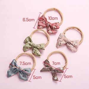 Detailed size chart showing soft nylon baby headbands with printed floral bow measurements