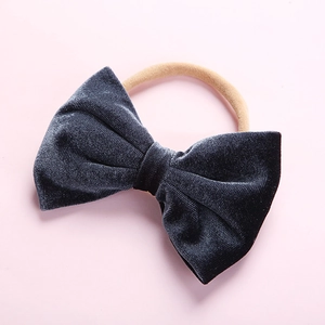 Close-up of dark grey velvet bow with high-elastic seamless nylon band for infants