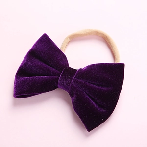 Close-up of soft purple velvet bow headband with seamless high elasticity flesh-colored band