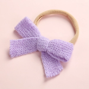 Detail of lavender knitted bow with soft texture and high-stretch nylon baby headband
