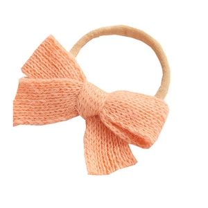 Knitted light orange bow headband for babies with soft nylon elastic band for infants