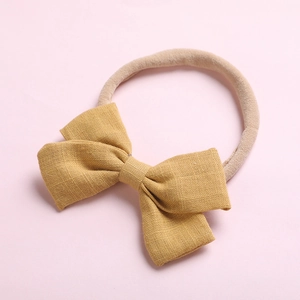 Bandeau souple en nylon avec nœud papillon jaune moutarde pour bébés et nourrissons