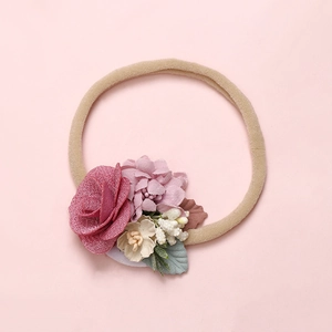 Detail of baby floral headband with pink fabric roses and high-elastic nylon band