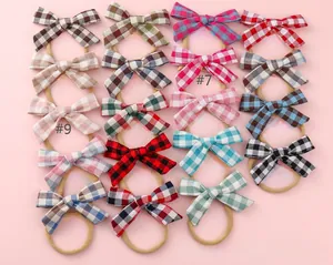 Selection of 19 colorful checkered bow headbands for babies with elastic nylon bands