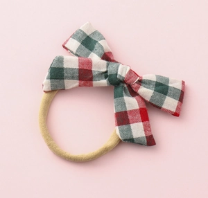 Detail of red and green plaid hair bow with high-elastic seamless ponytail holder band