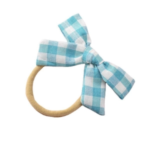 Blue checkered bow hair tie for baby girls made of soft linen cotton material