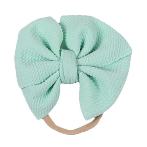 Mint green waffle fabric double bow headband with elastic nude nylon band for babies