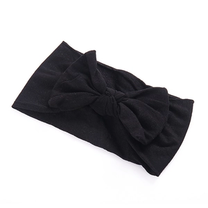 Zachte zwarte nylon baby haarband met grote elastische strik voor jonge kinderen