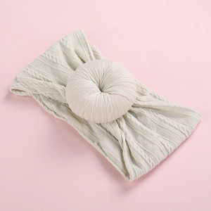 Mint green baby nylon headband with large jacquard doughnut knot and braided texture