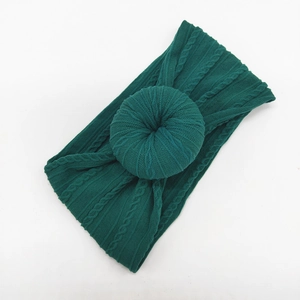 Dark green knitted jacquard baby headband with donut ring decoration and twist texture